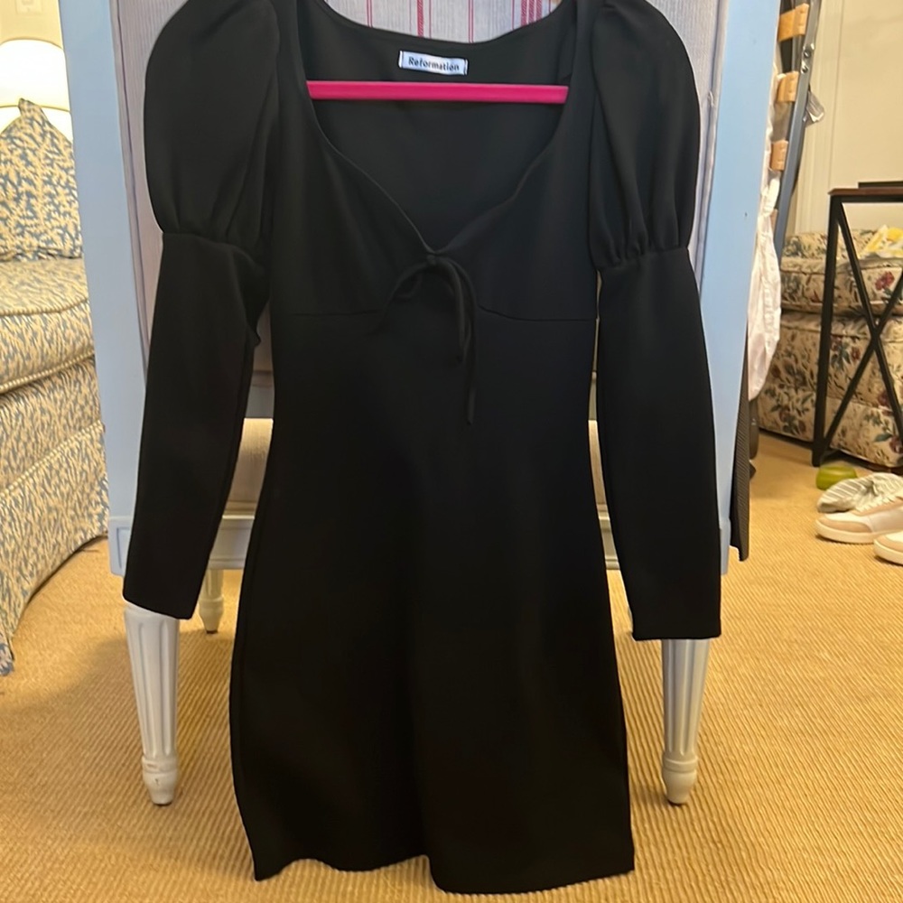 reformation dress with puff sleeve and heart shaped neck line with tie.